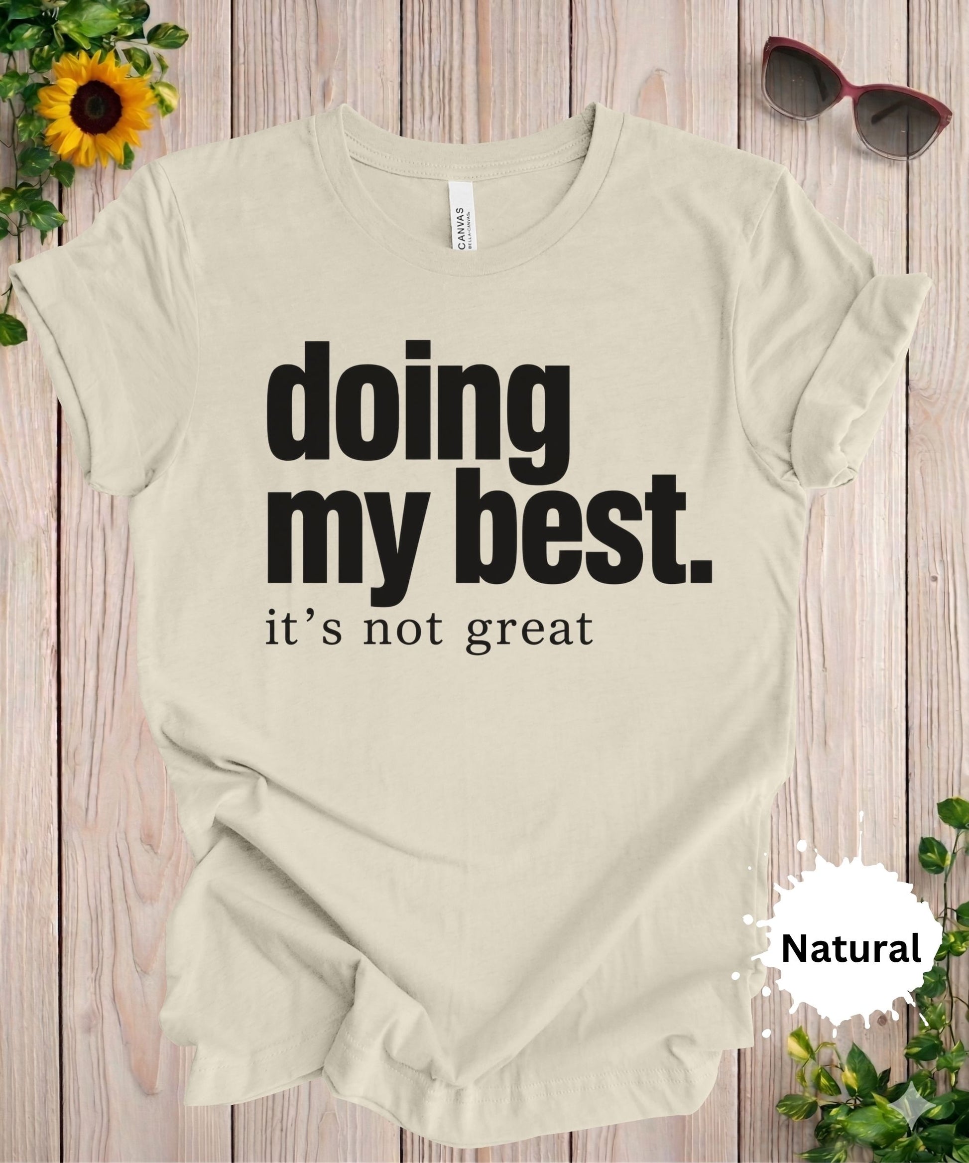 Women’s graphic T-shirt with the phrase “doing my best. it’s not great” in a bold typography