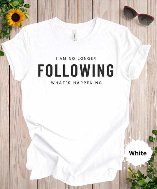 Women’s graphic T-shirt with the phrase “I am no longer following what’s happening” in bold typography