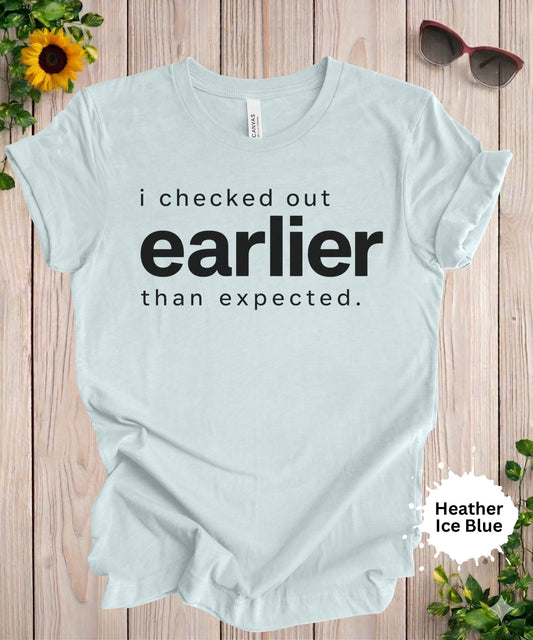Women’s graphic T-shirt with the phrase “i checked out earlier than expected” in bold typography
