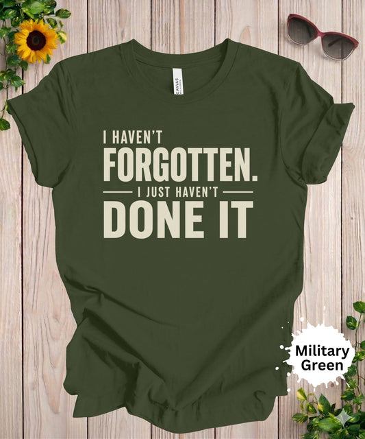 Women’s graphic T-shirt with the phrase “I haven’t forgotten. I just haven’t done it” in bold typography