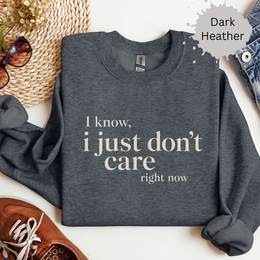 Sweatshirt with a medium bold typography reading “I know, I just don’t care right now”