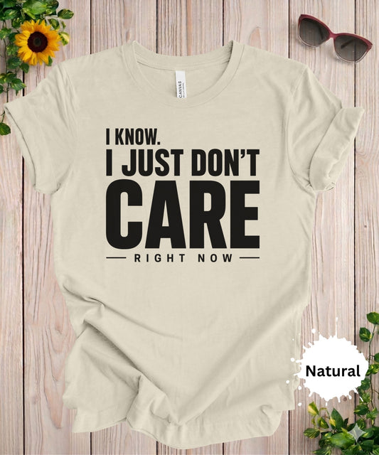 Women’s graphic T-shirt with the phrase “I know. I just don’t care right now” in bold typography