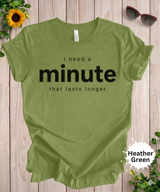 Women’s graphic T-shirt with the phrase “i need a minute that lasts longer” in bold typography