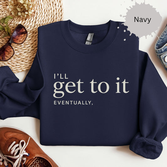 Sweatshirt with minimalist typography reading “I’ll get to it eventually”