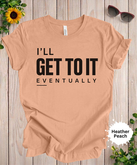 Women’s graphic T-shirt with the phrase “I’ll get to it eventually” in bold typography