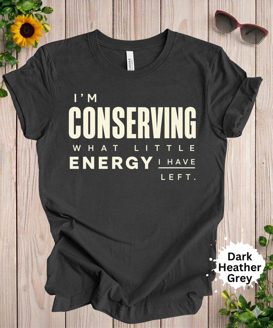 Women’s graphic T-shirt with the phrase “I’m conserving what little energy I have left” in bold typography