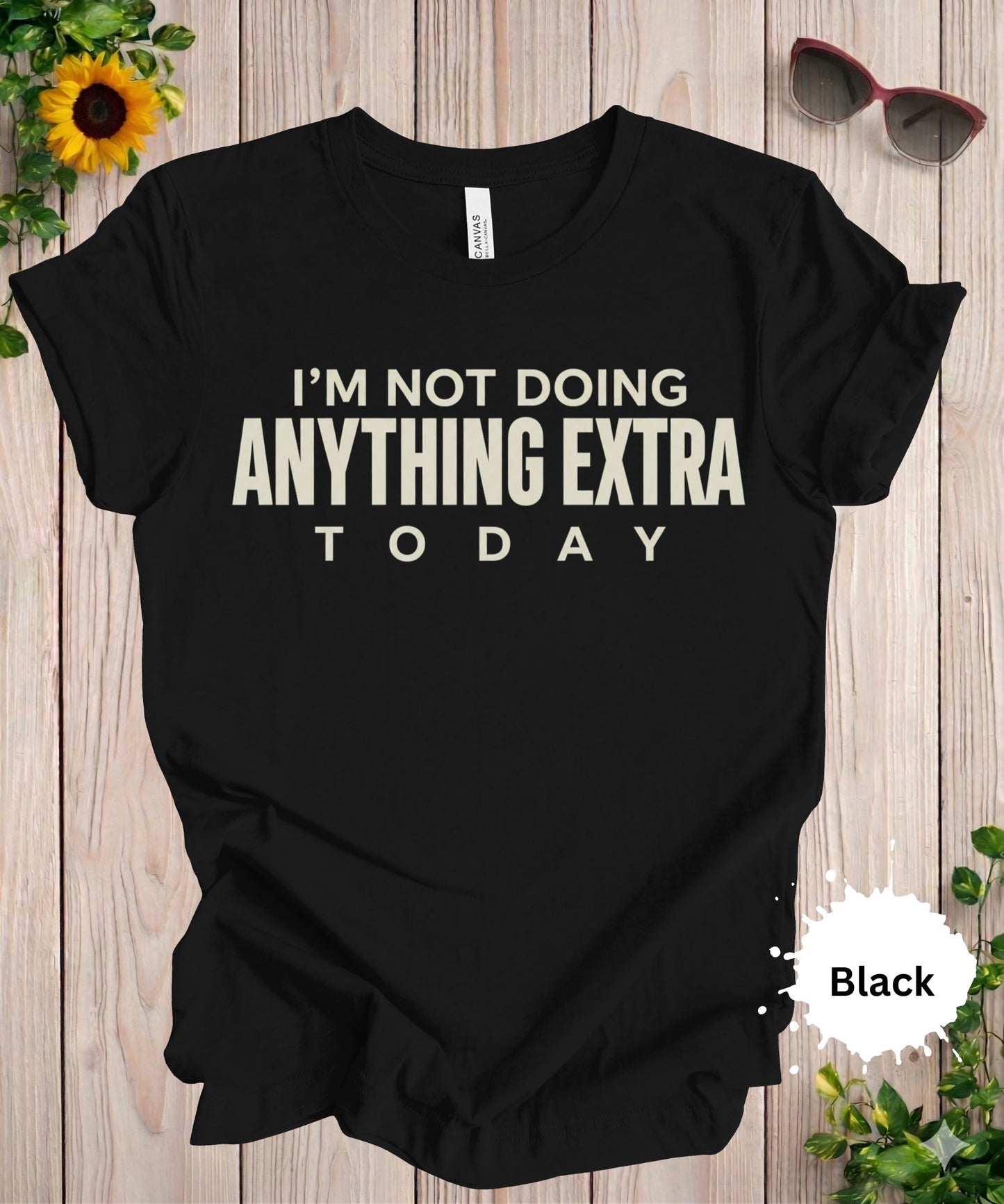 women’s graphic T-shirt with the phrase “I’m not doing anything extra today” in bold typography