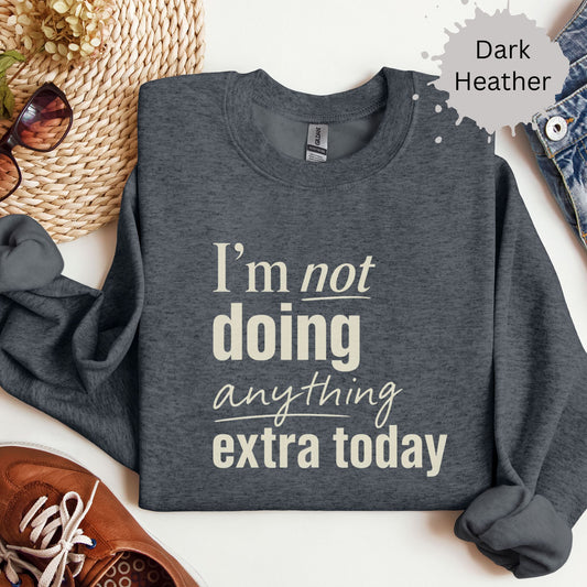 Sweatshirt with bold typography reading “I’m not doing anything extra today”