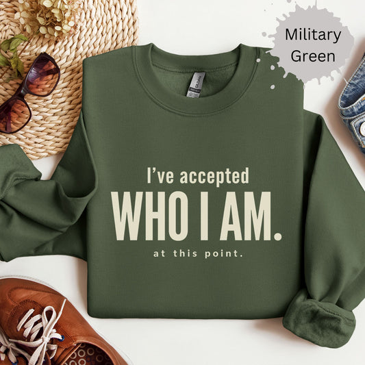 Womens sweatshirt with bold typography reading “I’ve accepted who I am at this point”