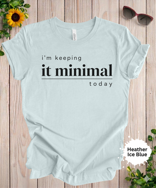 Woman’s graphic T-shirt with the phrase “i’m keeping it minimal today” in minimalist black typography
