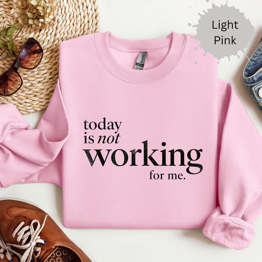 sweatshirt with typography reading “today is not working for me”
