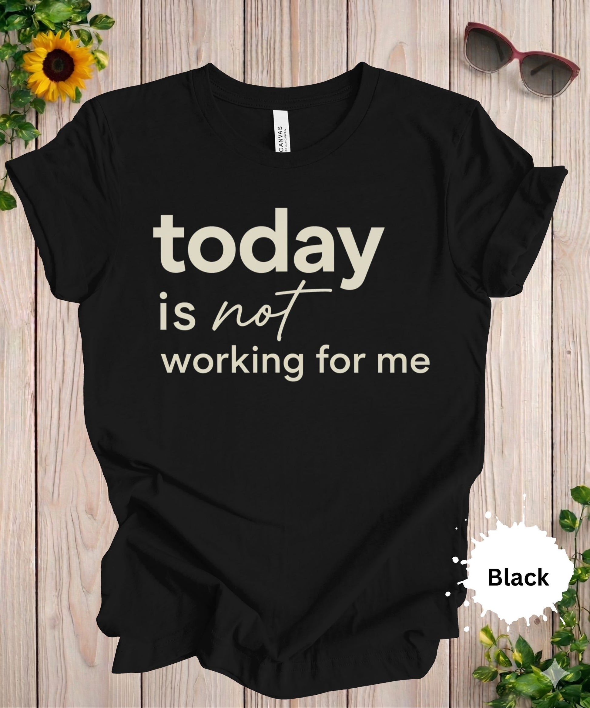 Women’s graphic T-shirt with the phrase “today is not working for me” in bold minimalist typography