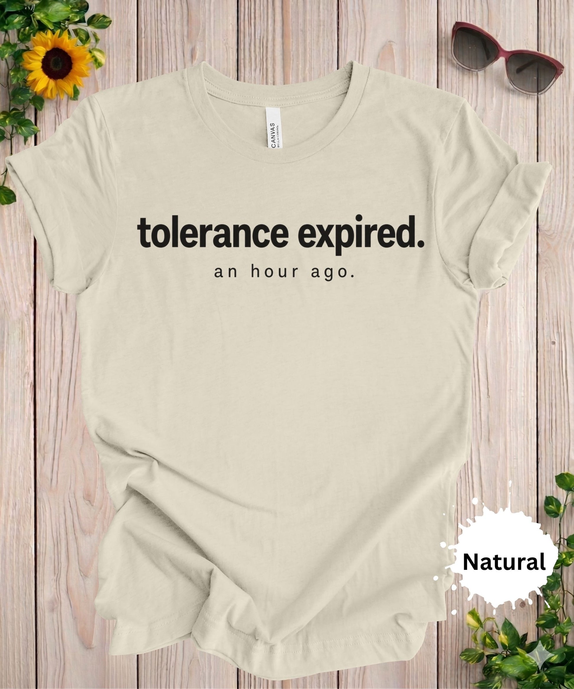 Women’s graphic T-shirt with the phrase “tolerance expired. an hour ago.” in minimalist typography