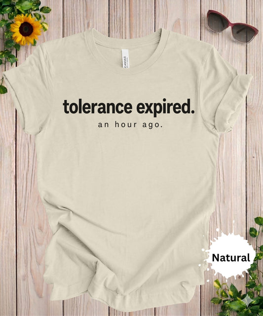 Women’s graphic T-shirt with the phrase “tolerance expired. an hour ago.” in minimalist typography