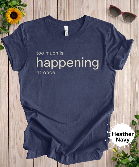 Women’s graphic T-shirt with the phrase “too much is happening at once” in minimalist typography