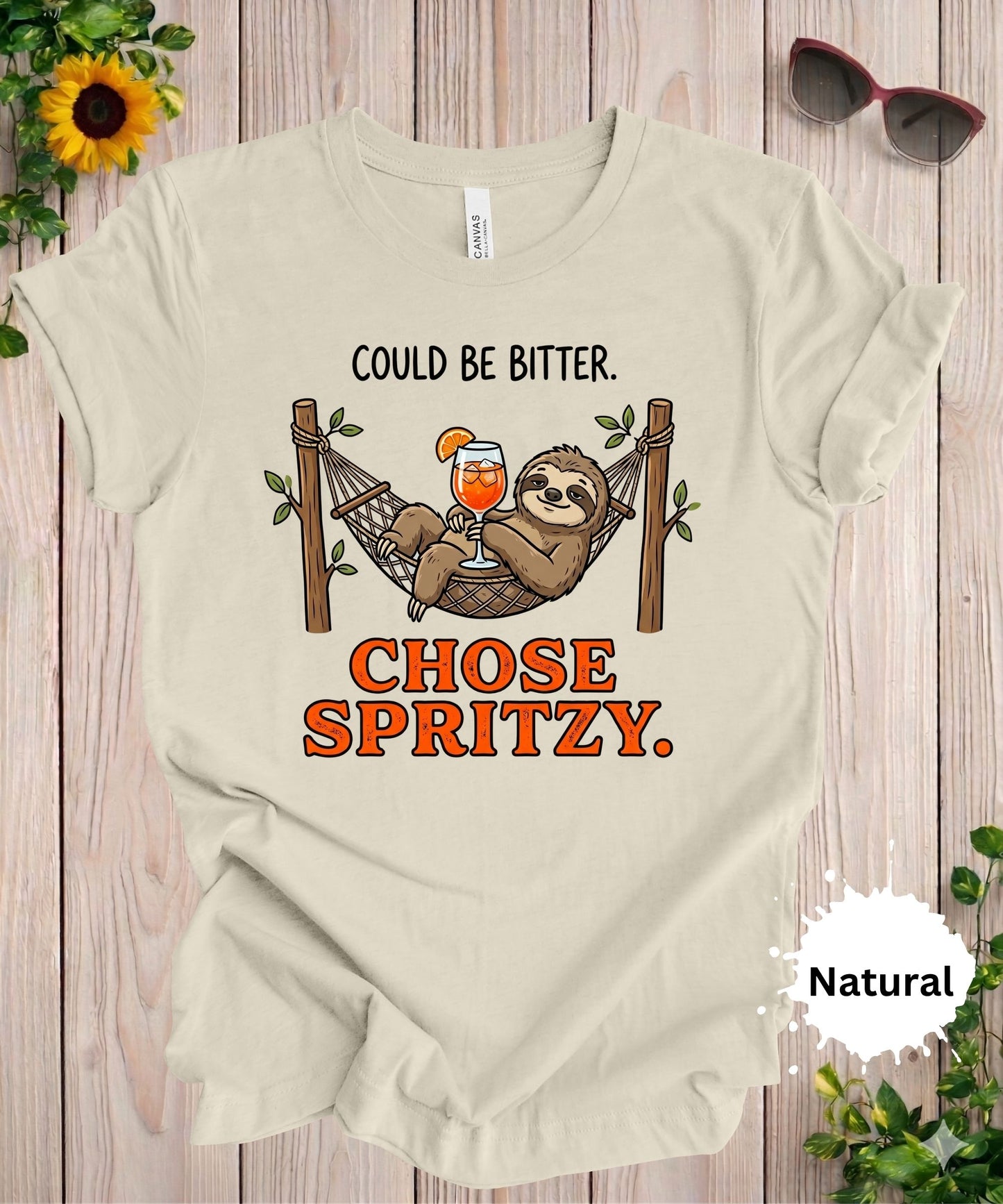 Woman wearing Could be bitter chose spritzy sloth graphic t-shirt with hammock and cocktail illustration