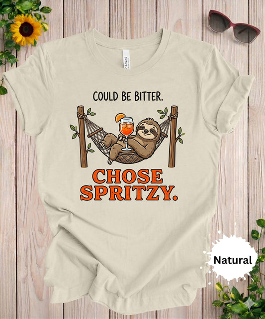Woman wearing Could be bitter chose spritzy sloth graphic t-shirt with hammock and cocktail illustration
