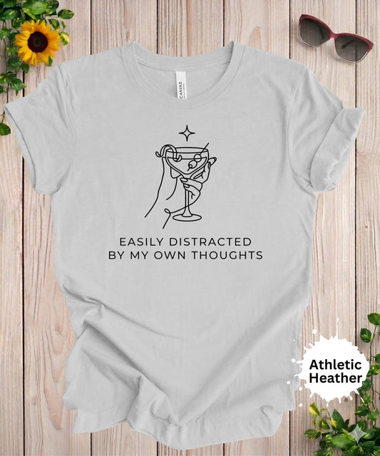 Woman wearing easily distracted by my own thoughts minimalist graphic t-shirt with martini glass illustration