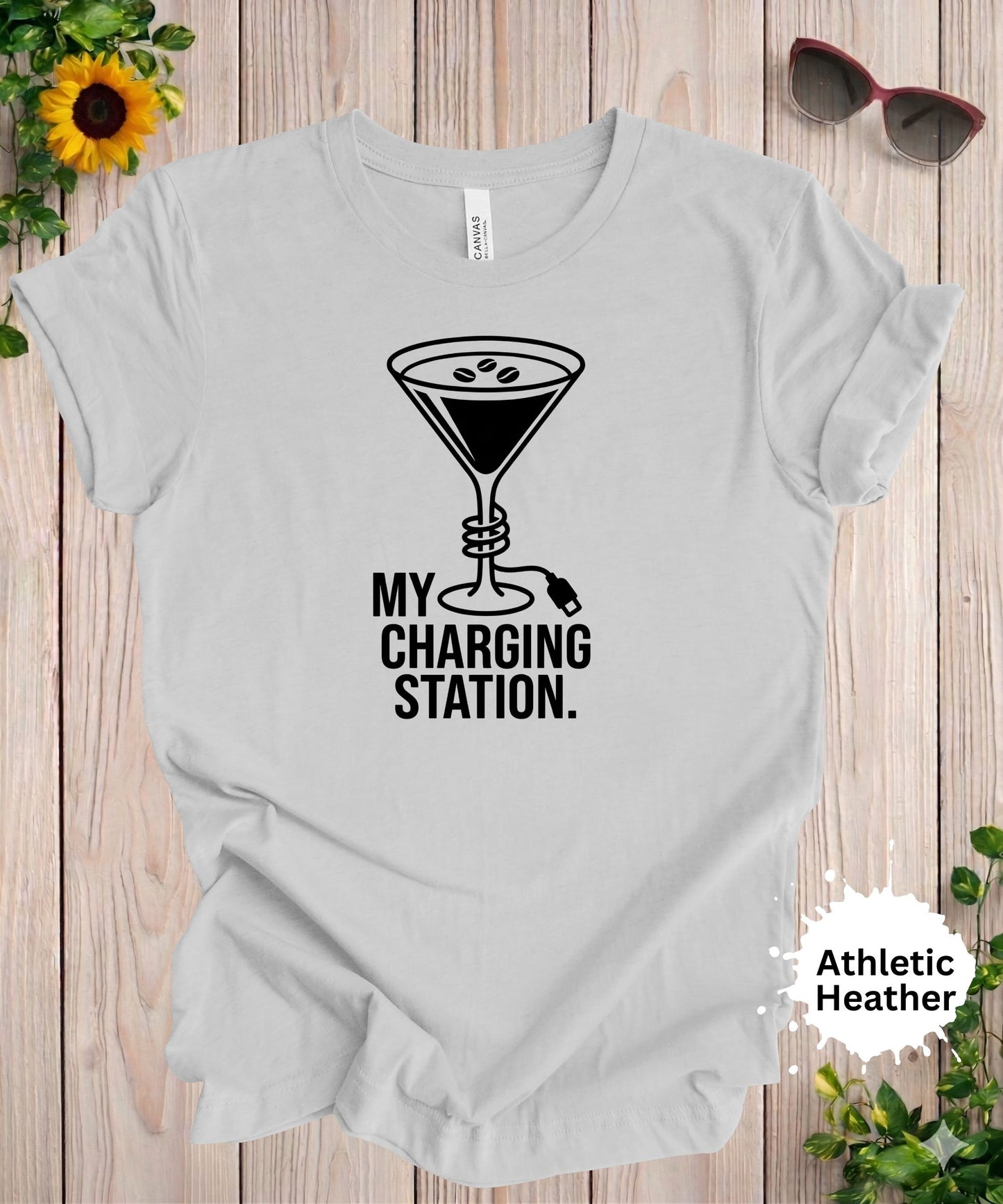 Funny martini t-shirt with charging station phrase and martini glass with plug design in a clean minimalist style