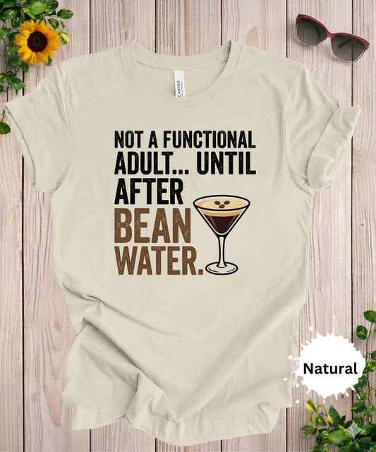 Funny coffee and martini t-shirt with the phrase not a functional adult until after bean water and espresso martini graphic