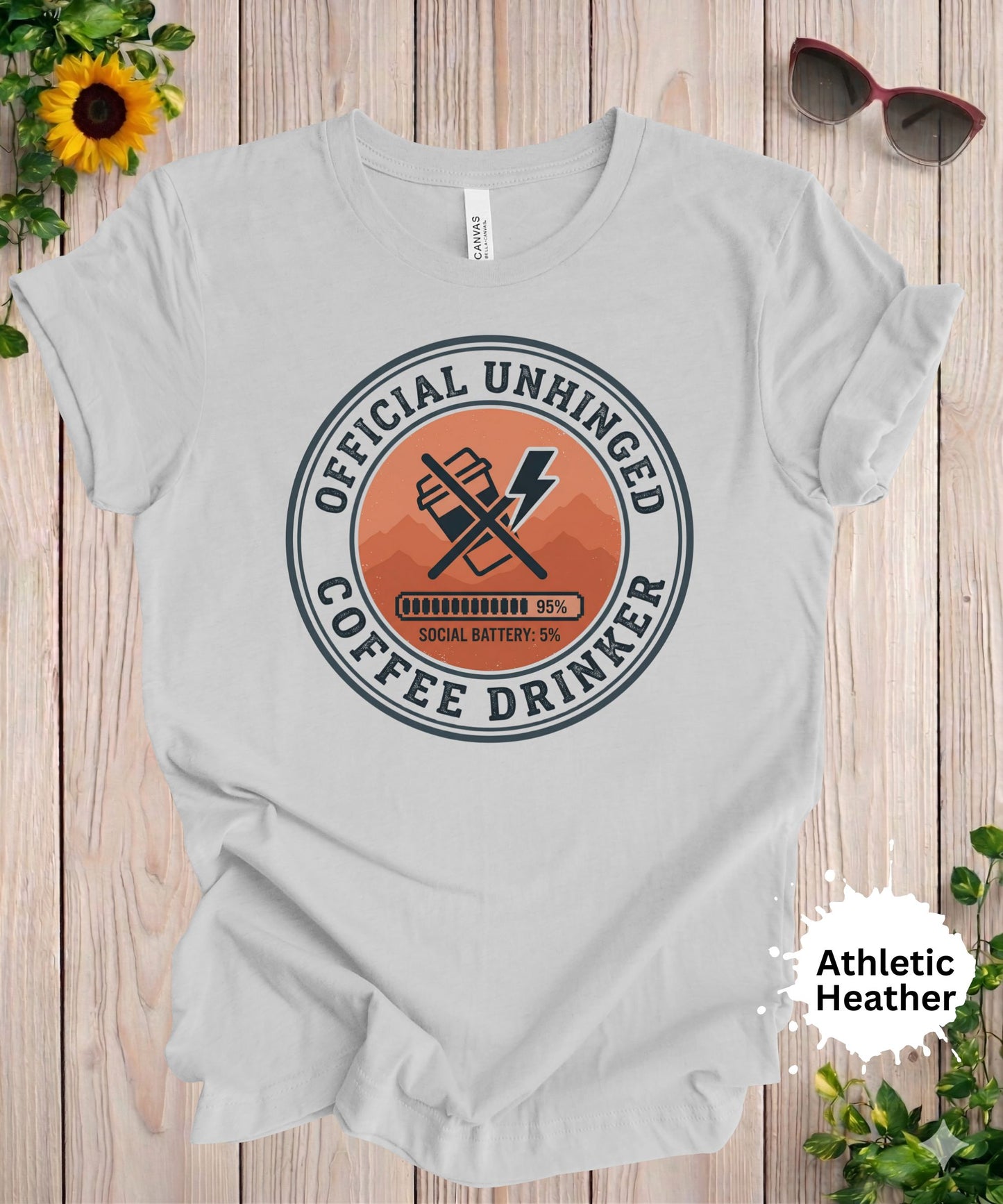 Woman wearing officially unhinged coffee drinker graphic t-shirt with badge style caffeine design